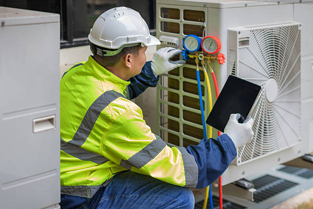 Professional Air Conditioning Repair technician working in Marcellus, MI